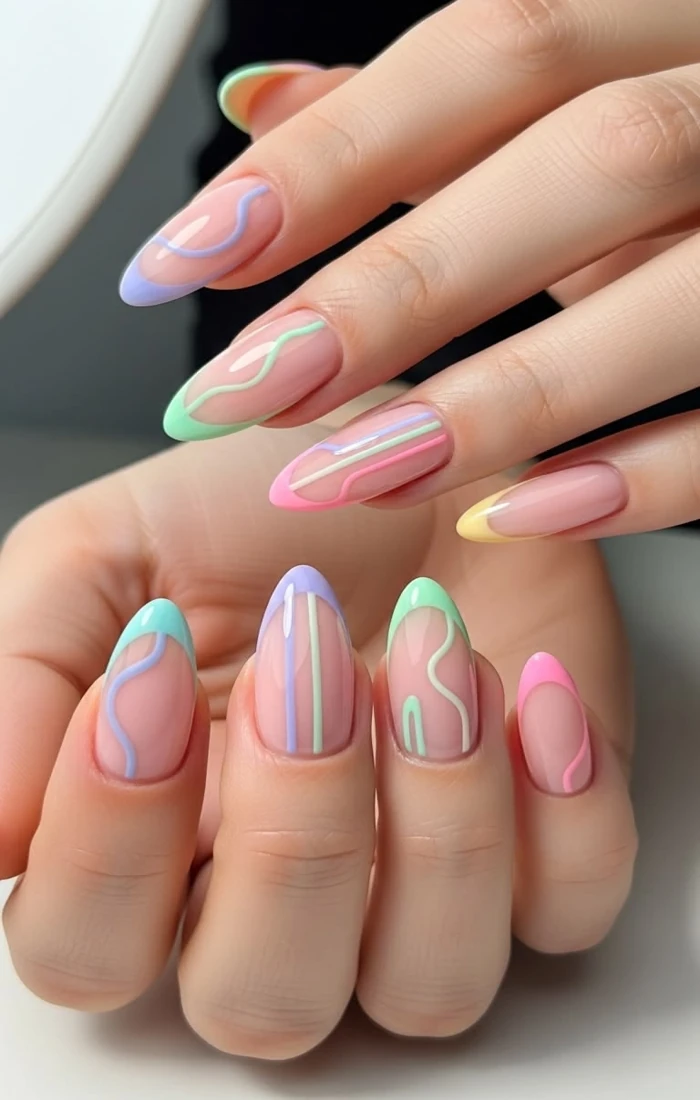 Almond nails with abstract swirl line art in neutral tones Almond nails with abstract swirl line art in neutral tones