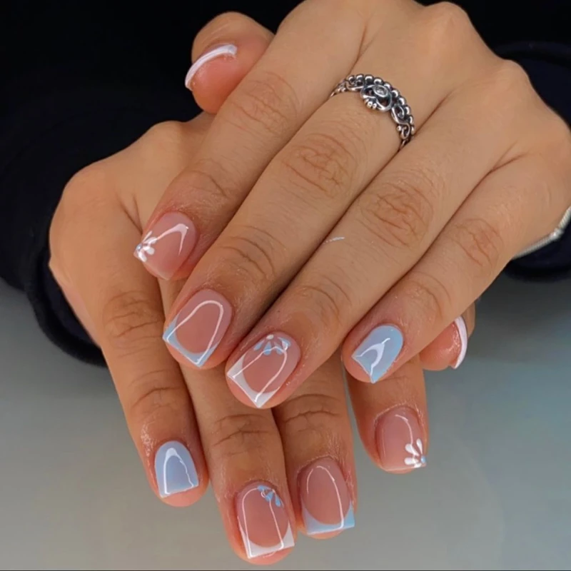 Festive Halloween Nails Featuring Playful Ghosts, Pumpkins, and Eerie Nail Art Accents
