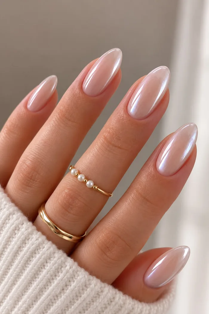 Milky pink almond nails with a high-shine top coat. Milky pink almond nails with a high-shine top coat.