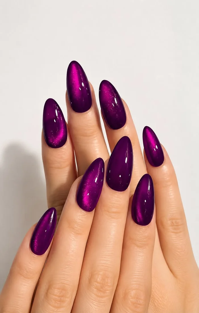 Amethyst purple cat eye nails with a luminous violet stripe. Amethyst purple cat eye nails with a luminous violet stripe.