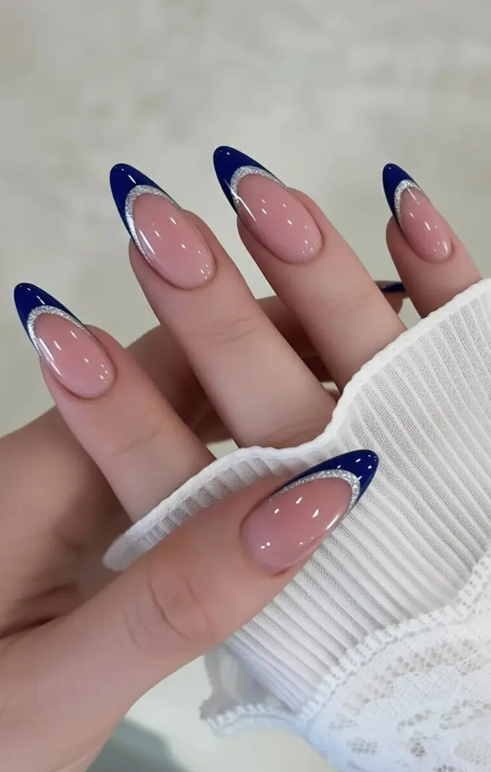 Baby blue French tip nails with a glossy natural base Baby blue French tip nails with a glossy natural base