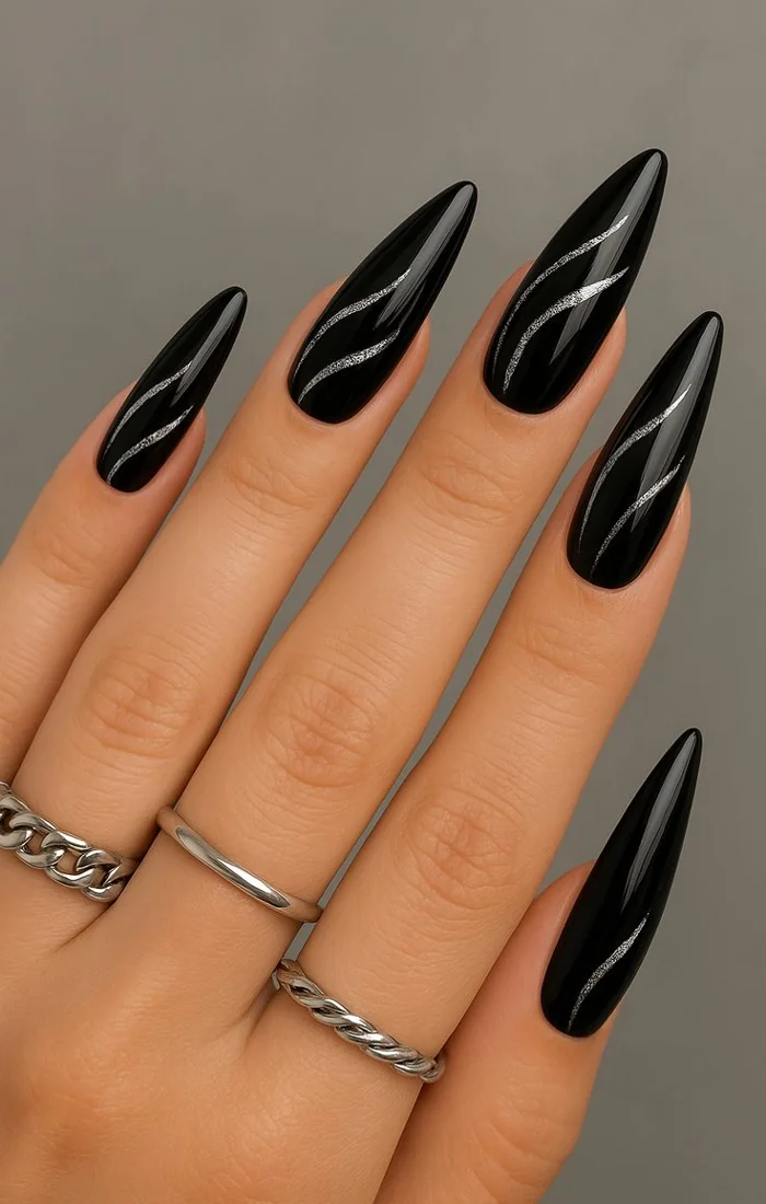 Black cat eye nails with a vivid emerald magnetic stripe. Black cat eye nails with a vivid emerald magnetic stripe.