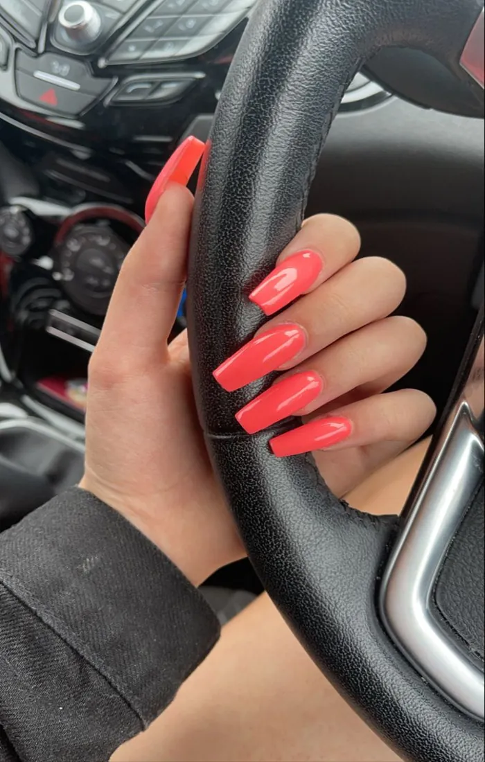 Bright coral summer coffin nails with a shiny finish Bright coral summer coffin nails with a shiny finish