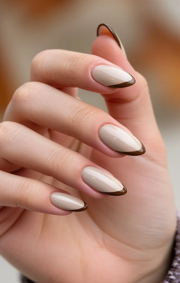 Chocolate brown chrome fall nails with a reflective metallic finish Chocolate brown chrome fall nails with a reflective metallic finish