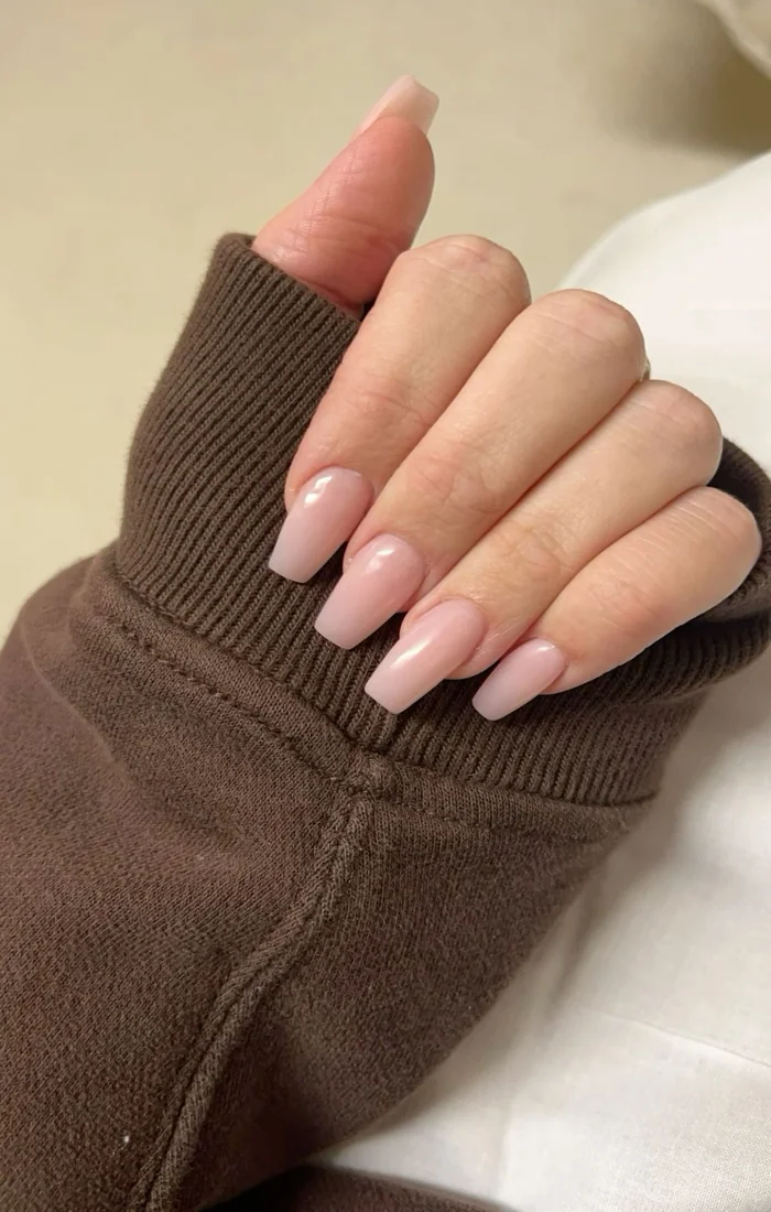 Classy nude coffin nails with a glossy finish and tapered square