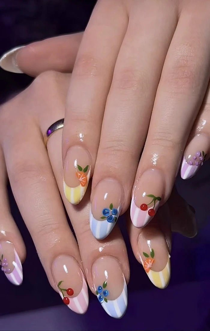 Cute summer fruit nails featuring tiny strawberries, lemons, and colorful details. Cute summer fruit nails featuring tiny strawberries, lemons, and colorful details.
