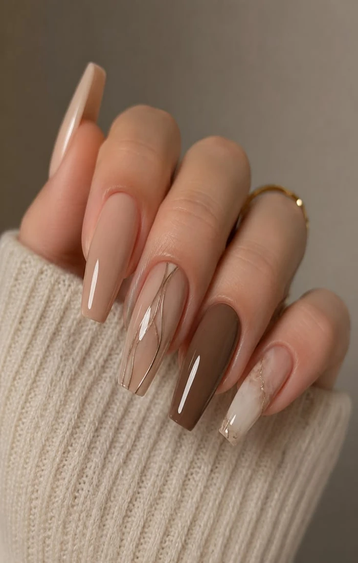 Elegant coffin nails with a glossy nude finish and tapered square tips Elegant coffin nails with a glossy nude finish and tapered square tips