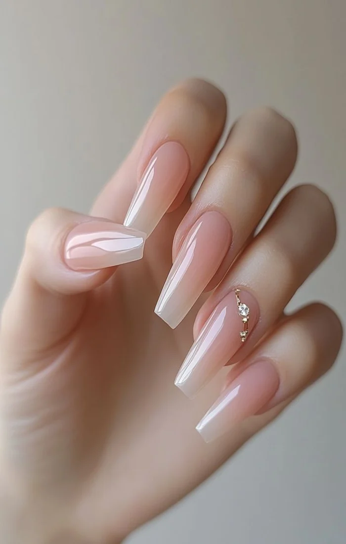 Elegant nude ombre coffin nails with a subtle beige gradient Elegant nude ombre coffin nails with a subtle beige gradient