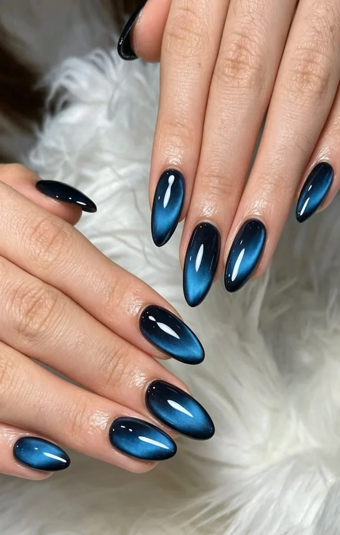 Galaxy cat eye nails with blue purple magnetic shimmer and tiny stars. Galaxy cat eye nails with blue purple magnetic shimmer and tiny stars.