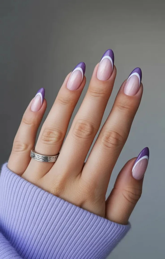 Lavender purple French tip nails with a glossy nude base. Lavender purple French tip nails with a glossy nude base.
