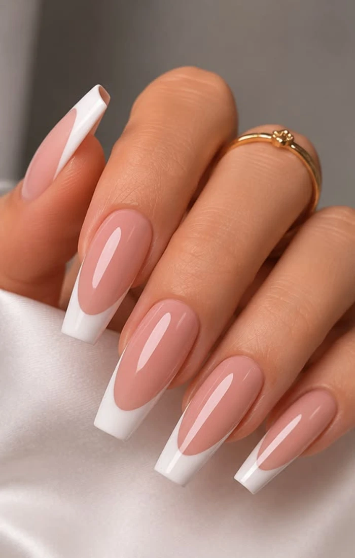 Long coffin French tip nails with clean white edges.