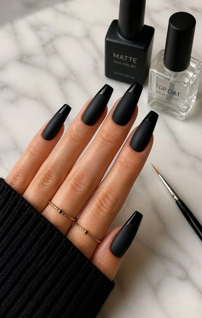 Matte black coffin nails with a smooth velvety finish Matte black coffin nails with a smooth velvety finish