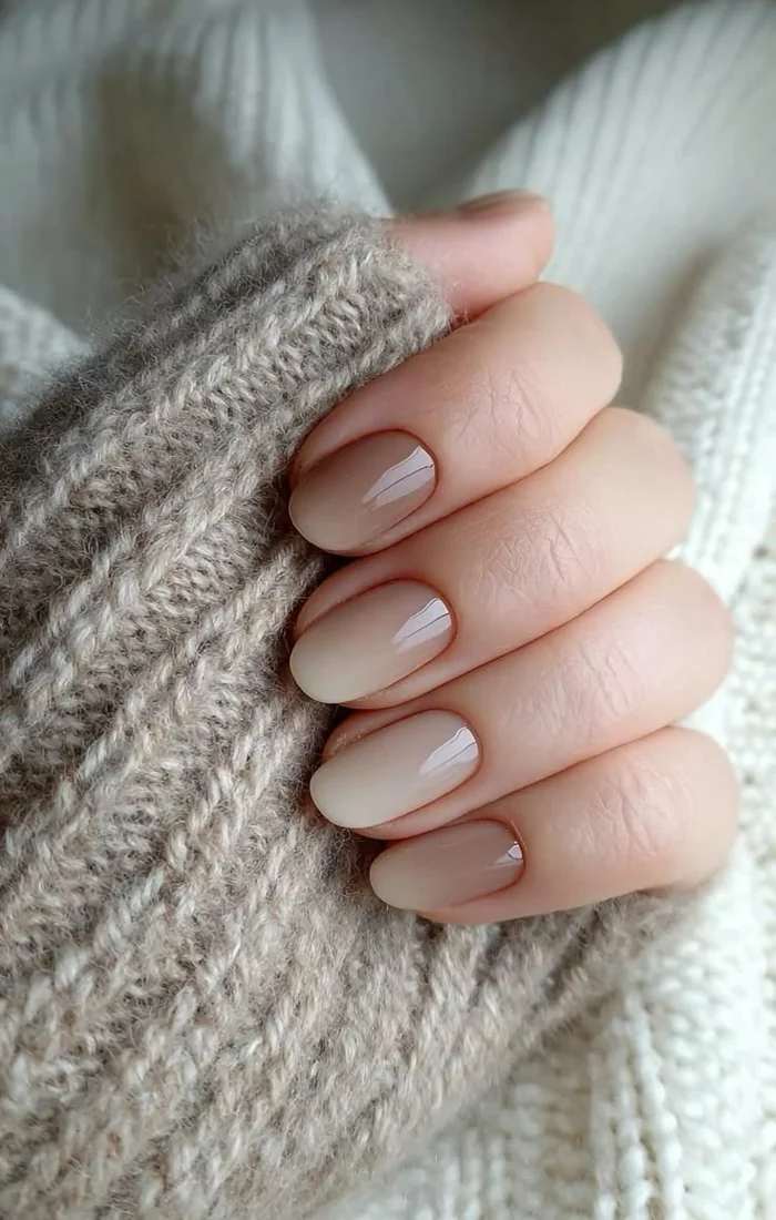 Neutral fall nails with milky beige polish and a smooth glossy finish Neutral fall nails with milky beige polish and a smooth glossy finish