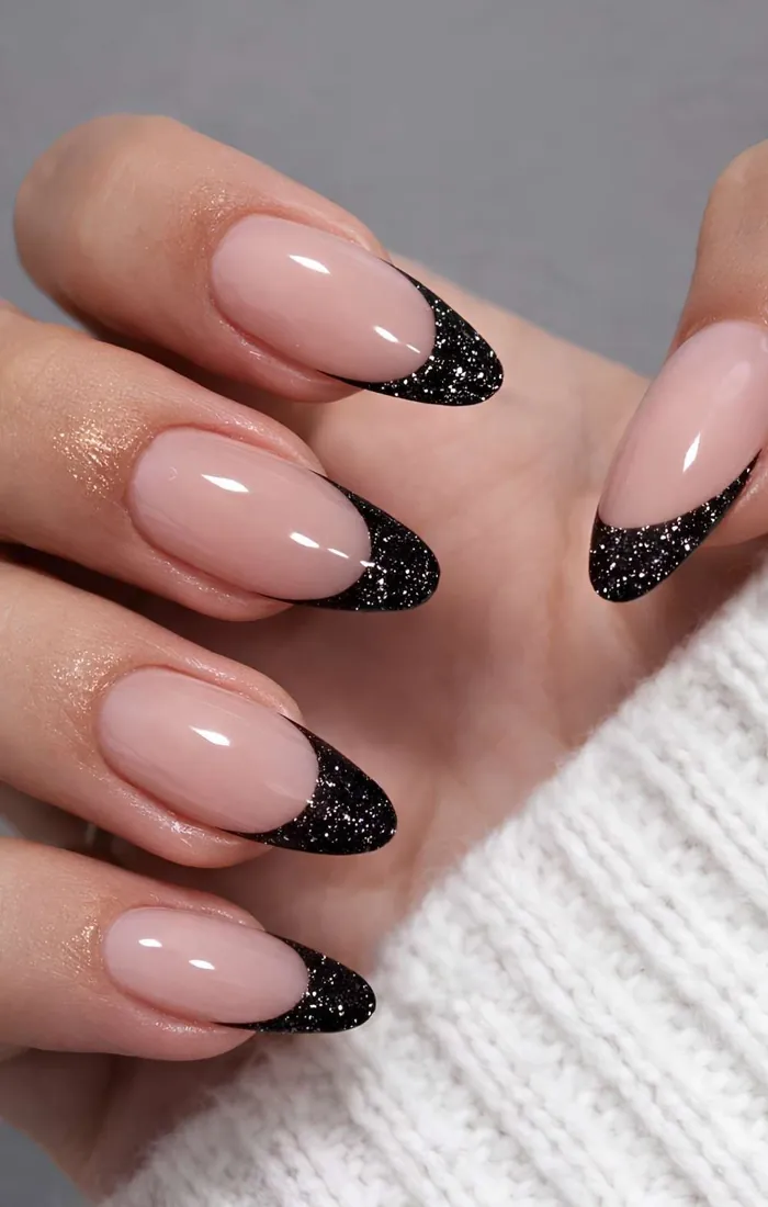 Nude French tip nails with sparkling silver glitter edges. Nude French tip nails with sparkling silver glitter edges.