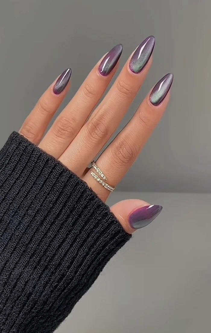 ink and purple two-tone cat eye nails with magnetic shimmer. ink and purple two-tone cat eye nails with magnetic shimmer.