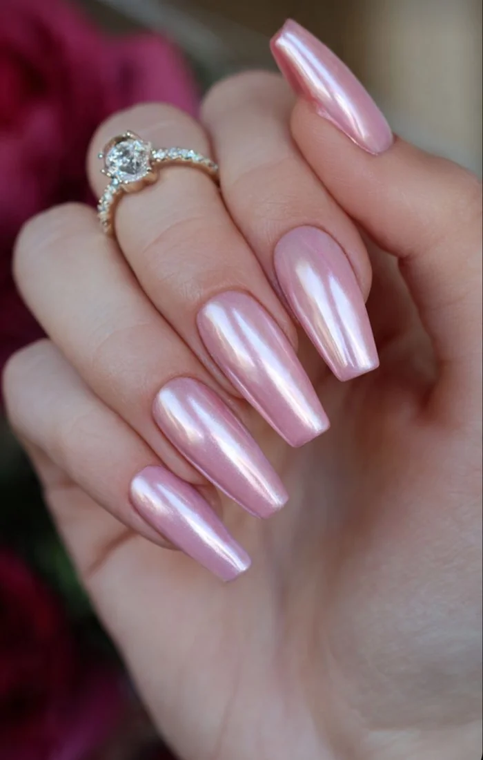 Pink chrome coffin nails with a reflective metallic shine Pink chrome coffin nails with a reflective metallic shine