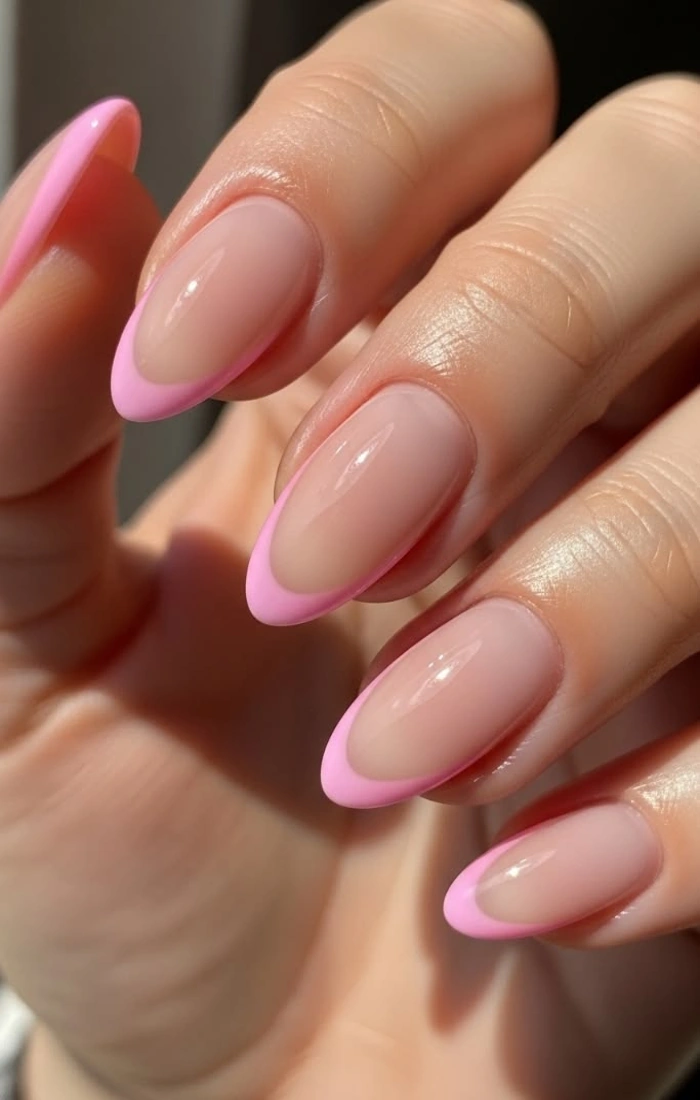 Soft pink French tip nails with a glossy blush base Soft pink French tip nails with a glossy blush base