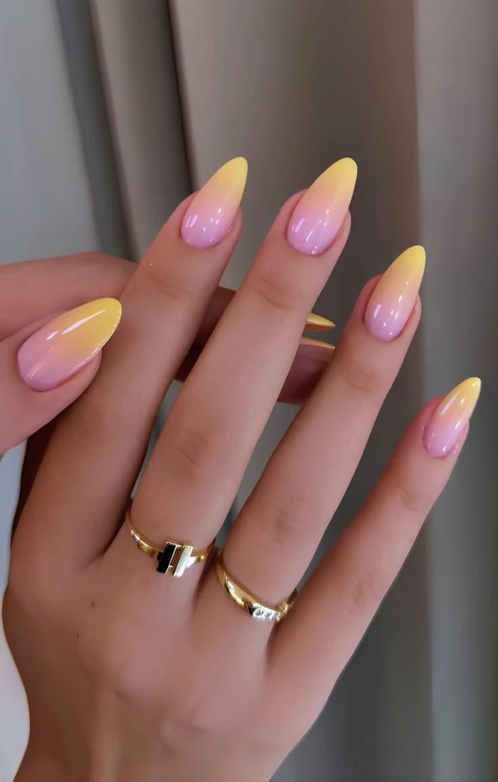 Summer almond nails in a soft pink shade with delicate white floral accents. Summer almond nails in a soft pink shade with delicate white floral accents.